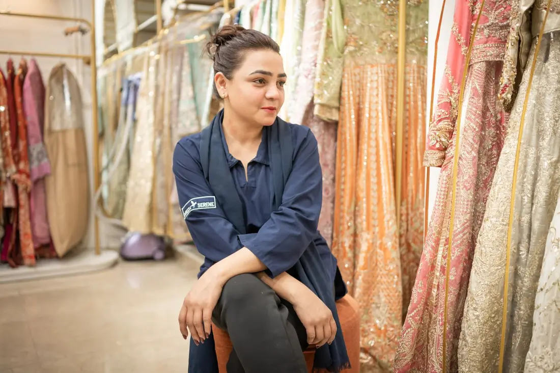 A boutique owner in her saree and lehenga shop in India